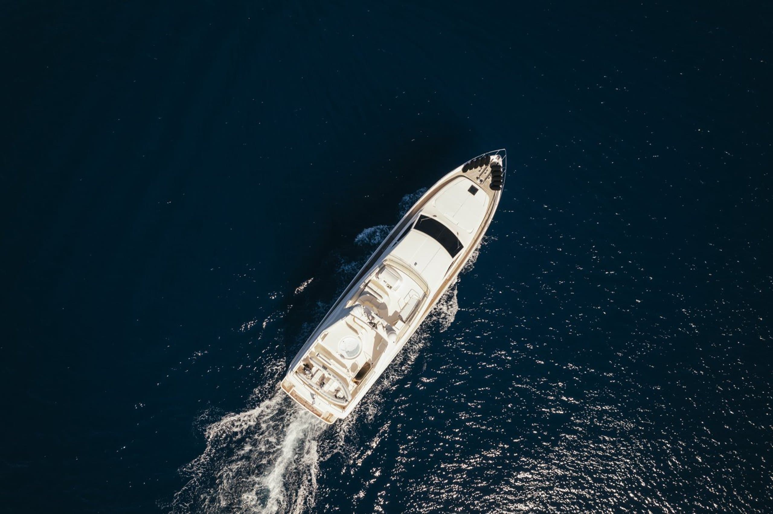 LIDIA - aerial overhead view of the motor yacht cruising on deep blue water | Drivas Yachts