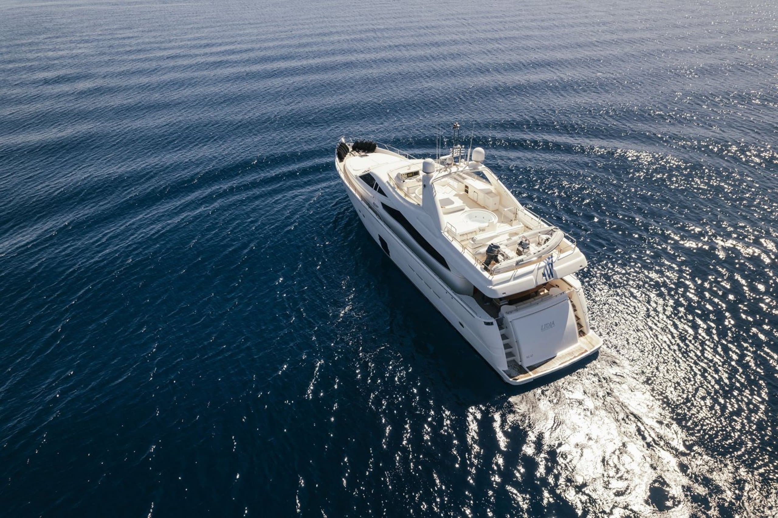 LIDIA - aerial view of the motor yacht's foredeck and flybridge from astern | Drivas Yachts