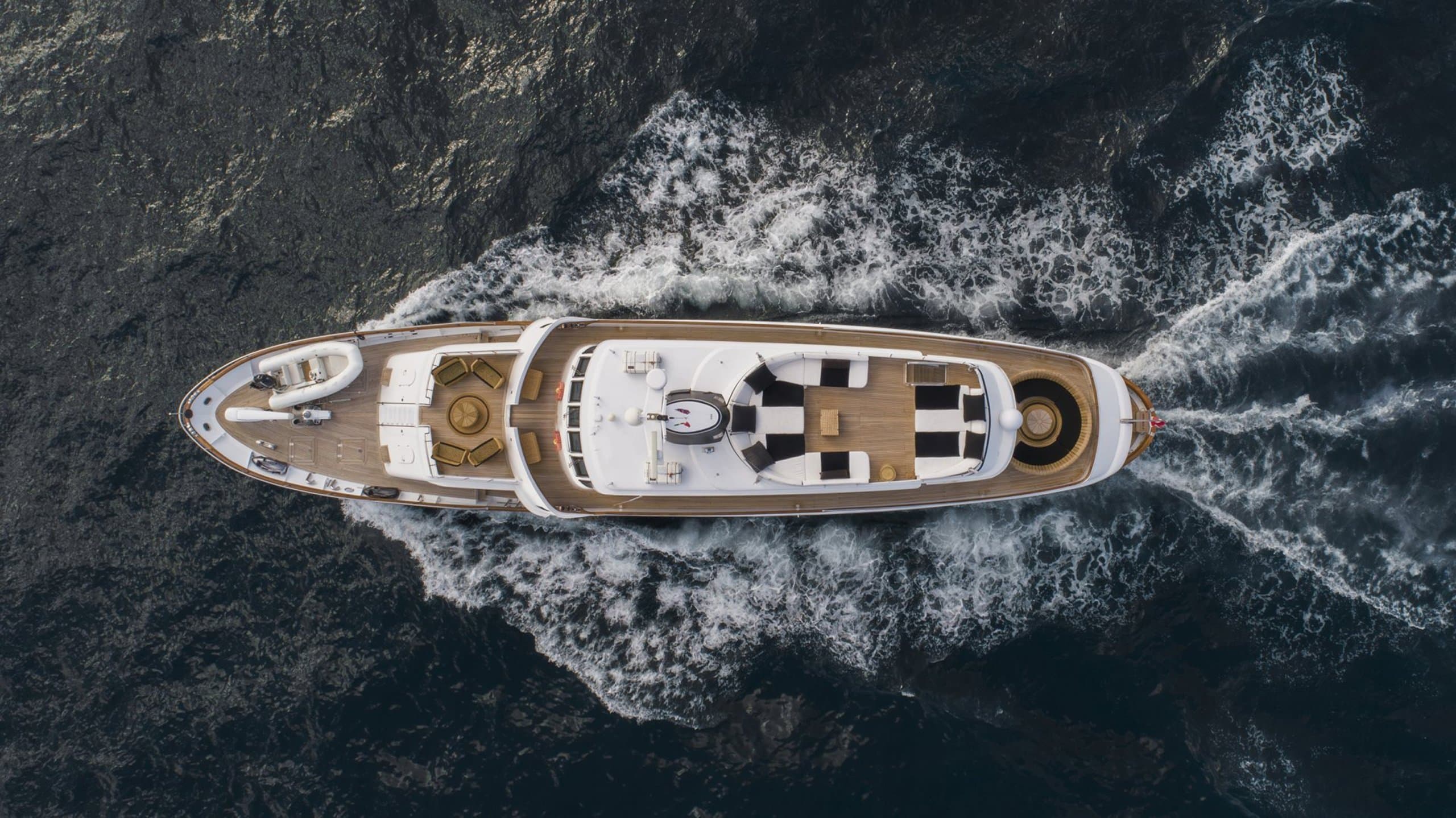 SOUNION II - overhead aerial view of the motor yacht cruising and leaving a wake | Drivas Yachts