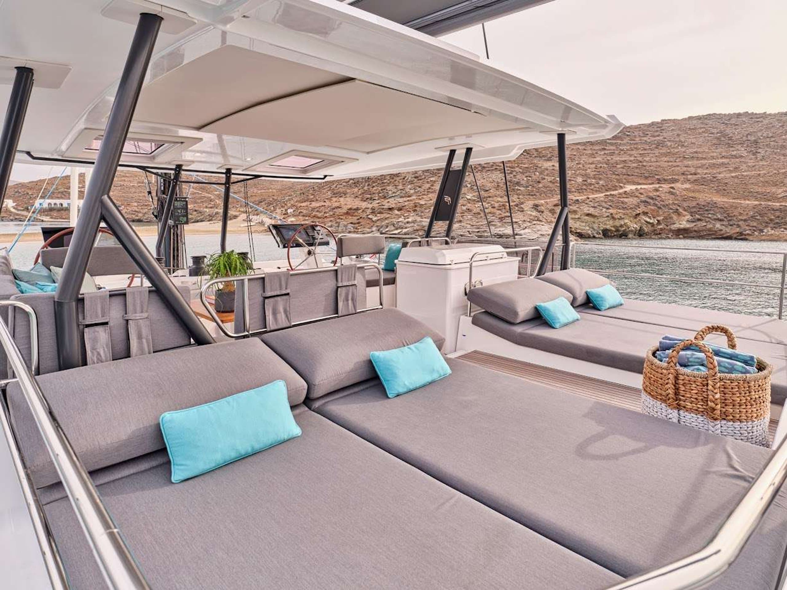 DOLLY - flybridge sun pads beside the helm station | Drivas Yachts
