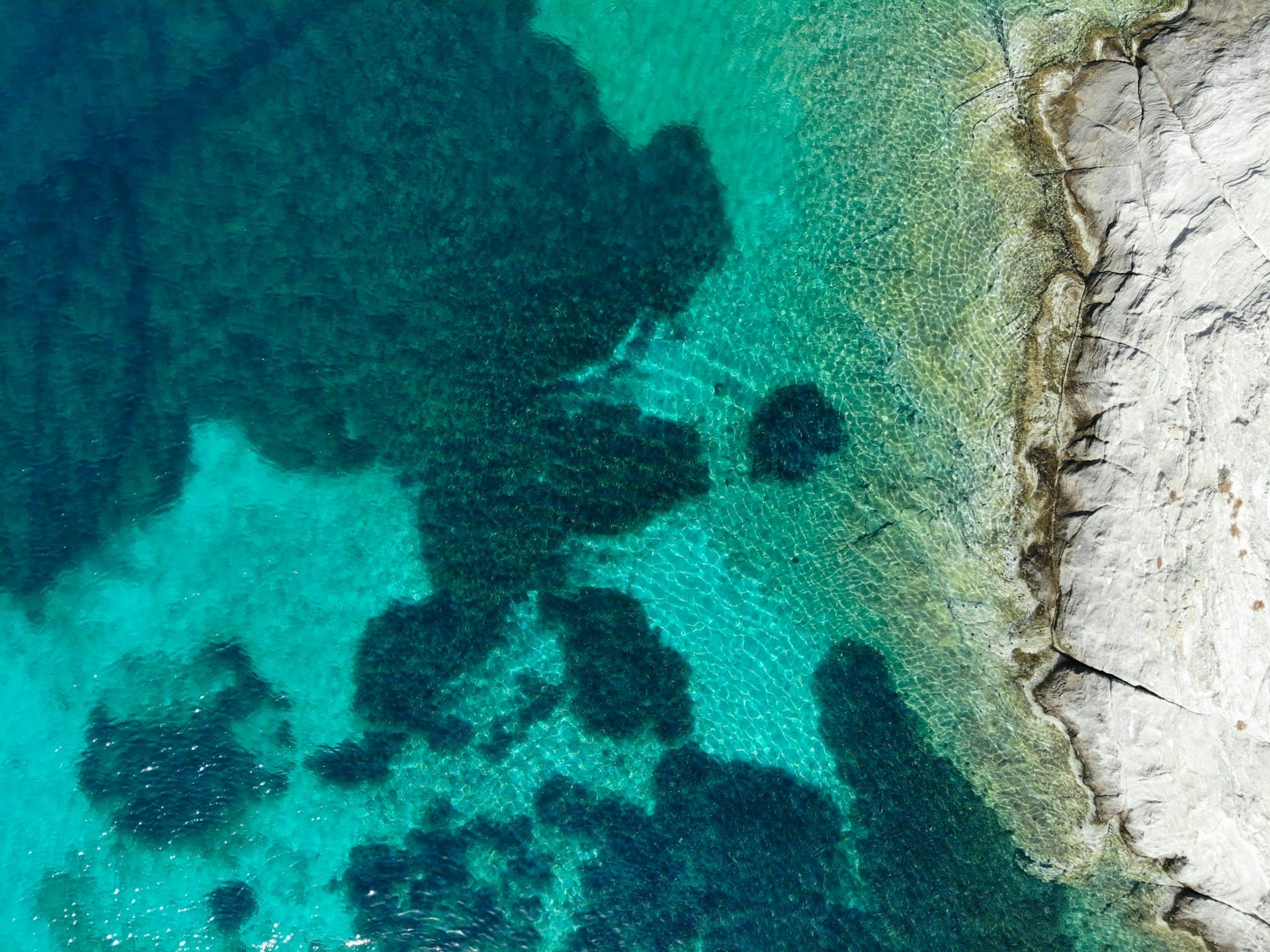 Aerial view of turquoise waters off Antiparos coast