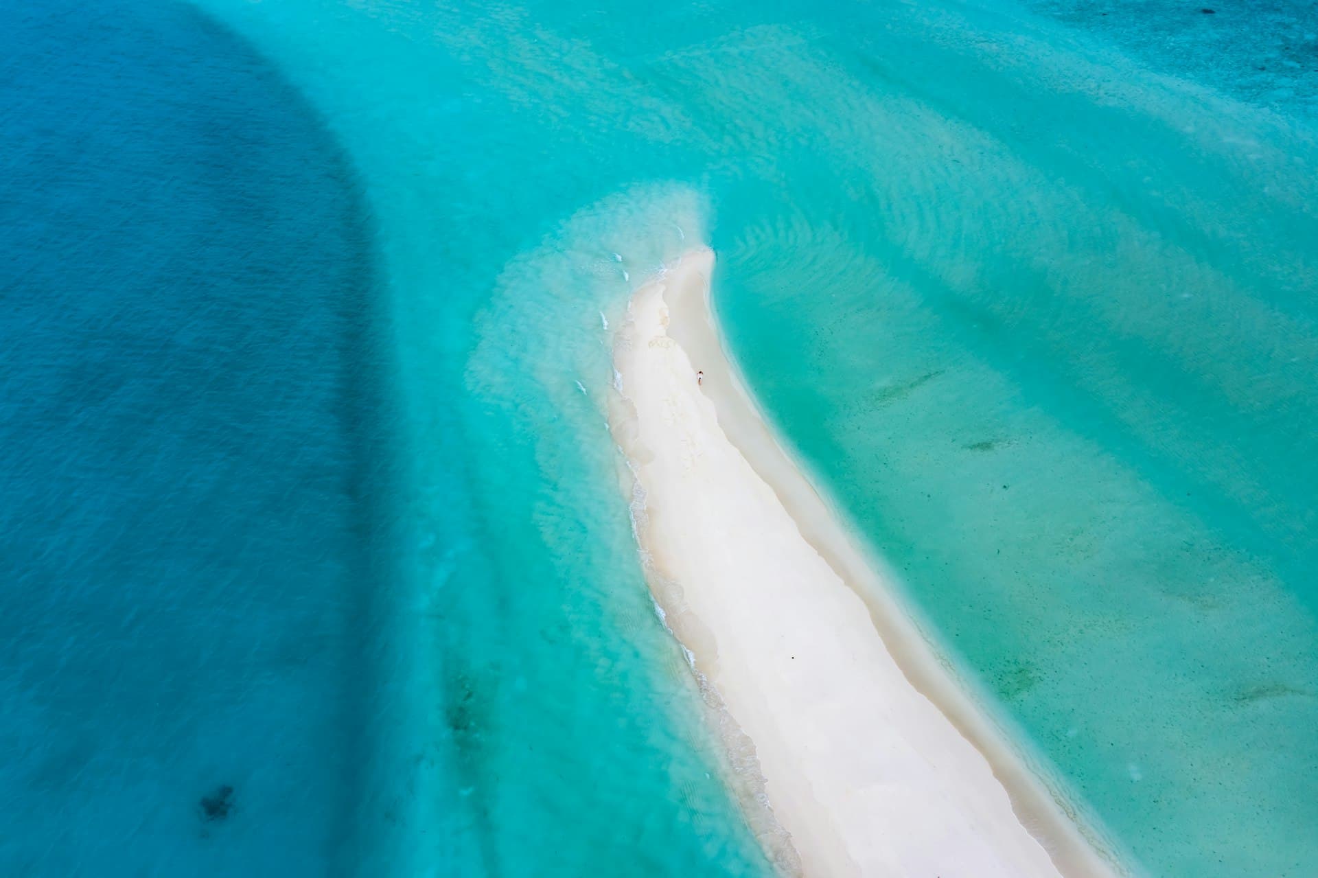 Maldives atoll with turquoise lagoon from above