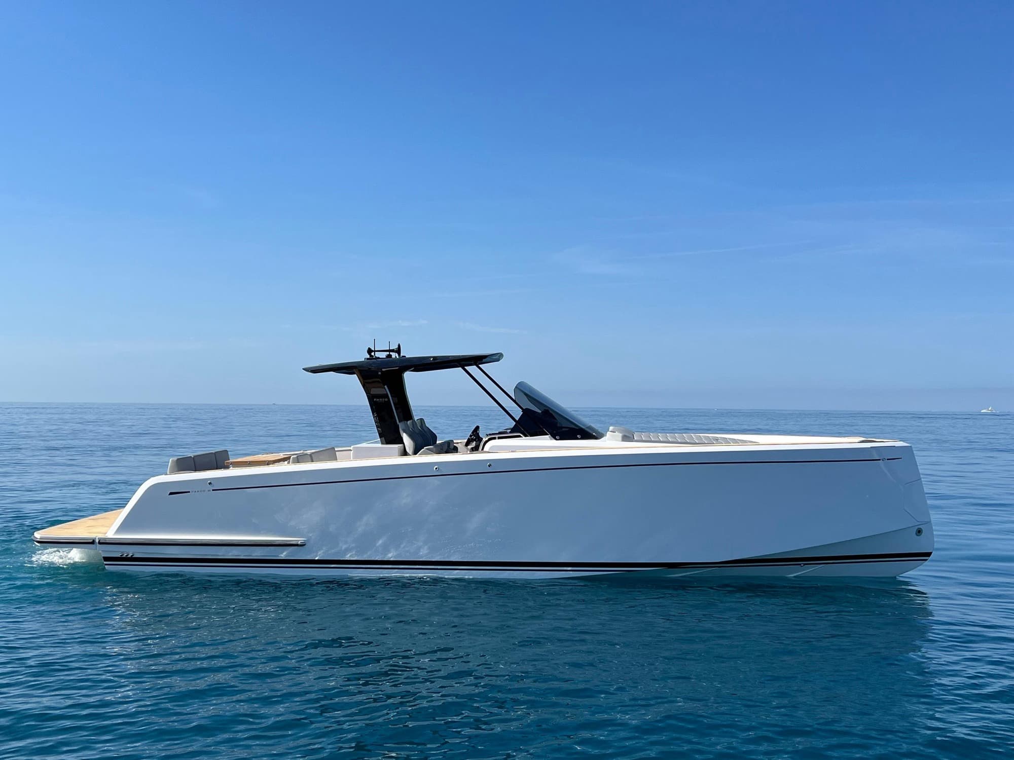 Pardo 38 alongside, sun pad forward.
