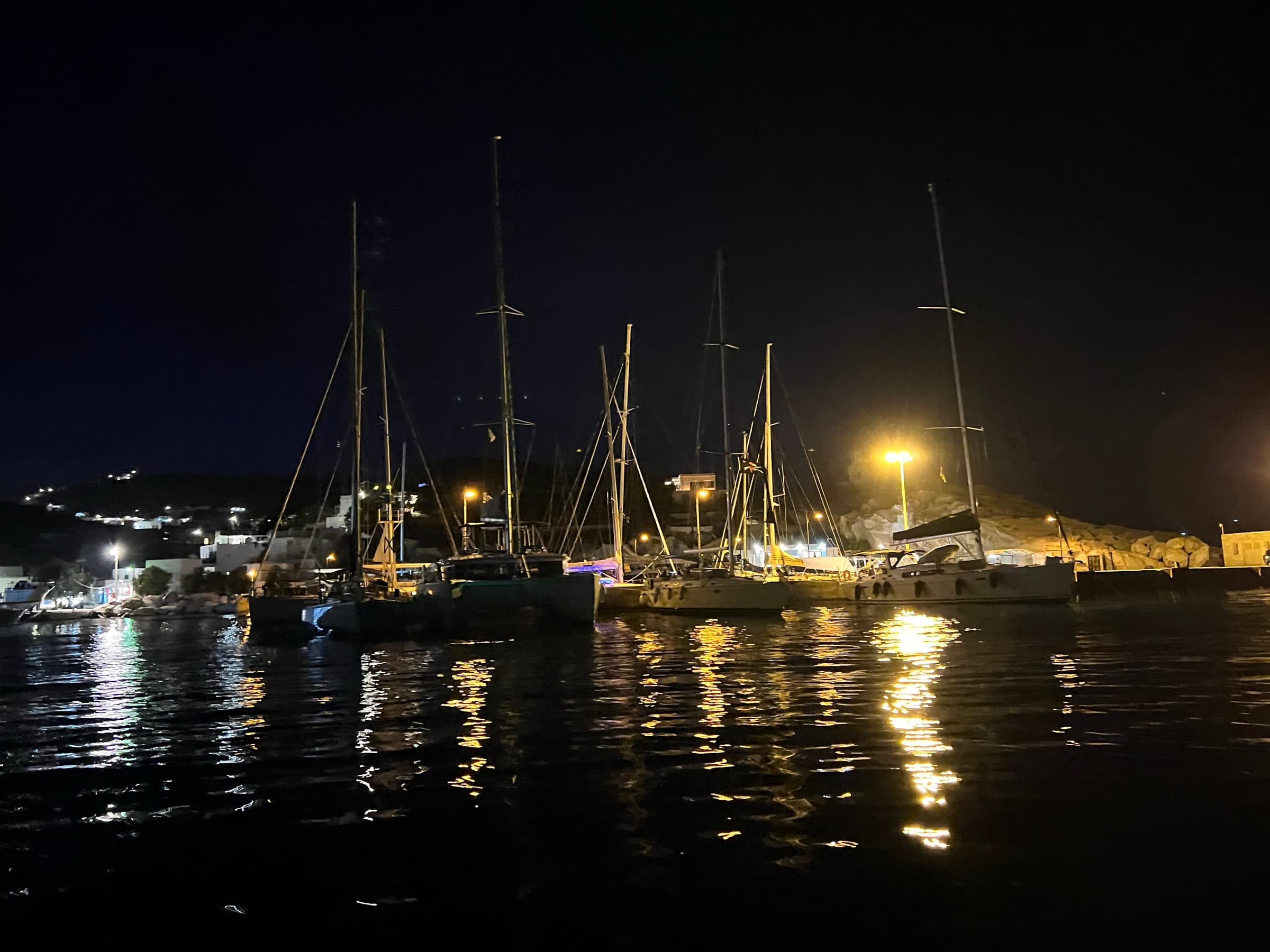 Sailing yachts on the quay of Psathi, Kimolos, at night