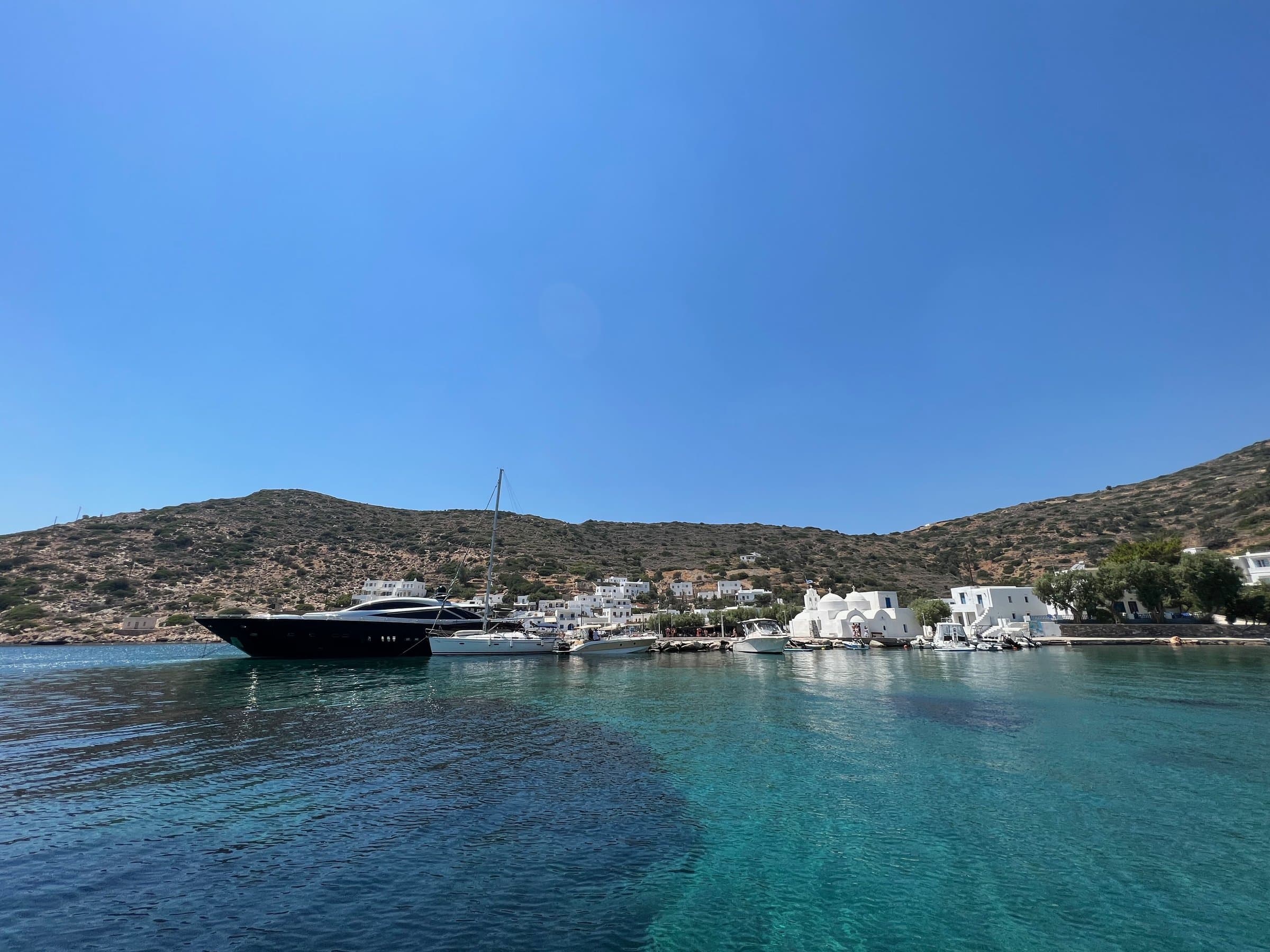 A yacht anchored off the church at Vathi, Sifnos